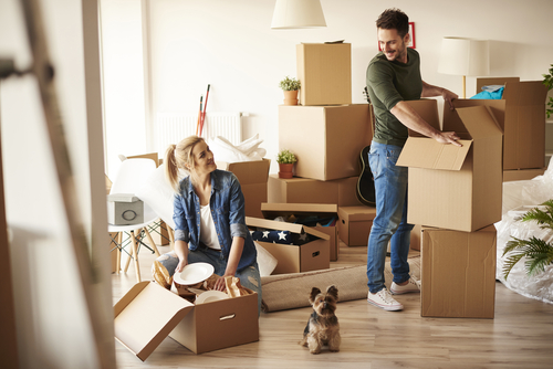 Approved Mortgage - A couple with a dog moving into a new home