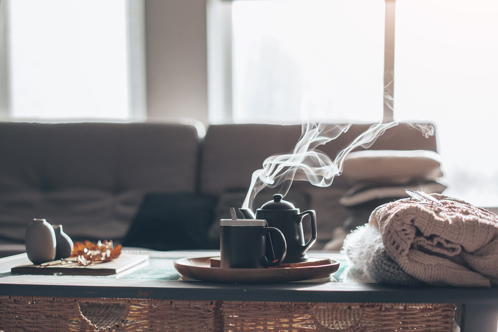 Approved Mortgage - Hot tea kettle with a tea cup